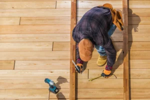 worker building a wood deck